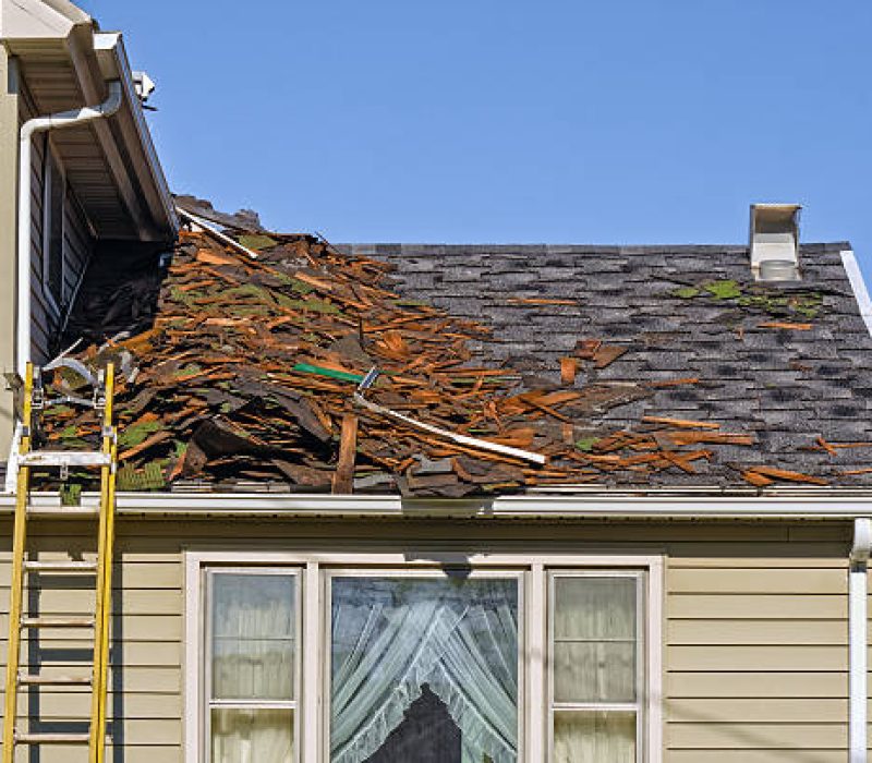 Old Roofing Being Removed on House to be Replaced by New Shingles